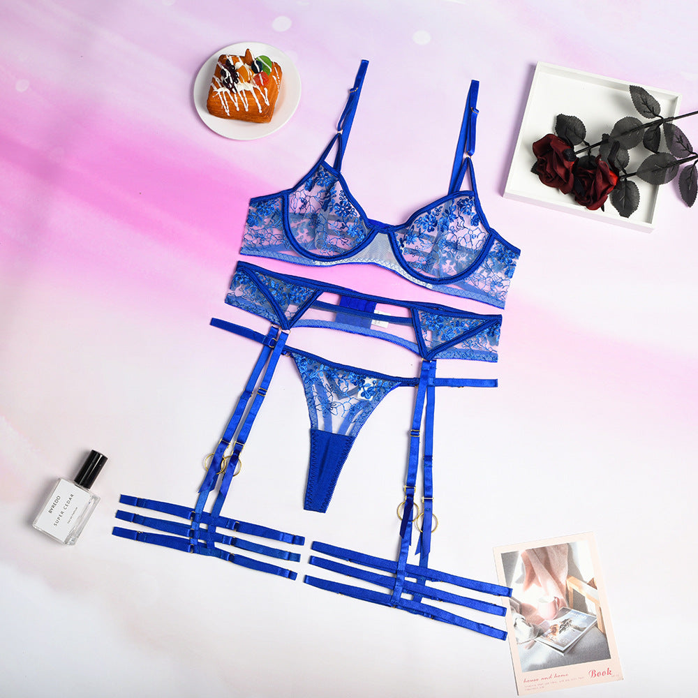 Women's blue embroidered lingerie set by eprolo, featuring delicate lace and sexy design, shown on a model.